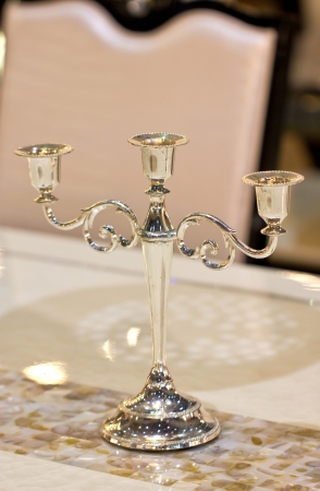 Vintage candlestick on table の写真素材
