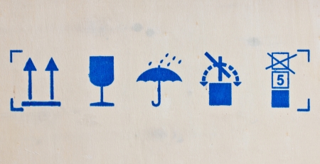 Fine image close-up of fragile symbol on woodboard の写真素材