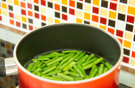 Lentils Pieces In Boiling Water In Red Pot.の写真素材
