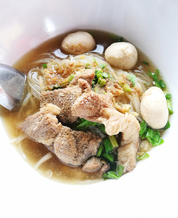Close Up Spicy Rich Flavour Noodle With Sliced Pork and Pork Balls, Street Food Style