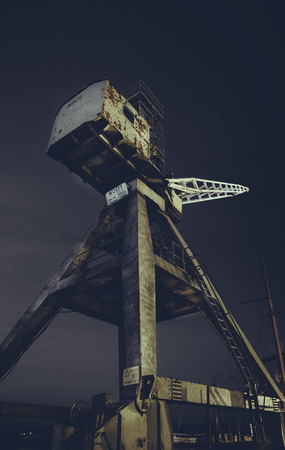 Big old crane used in the harbourの写真素材