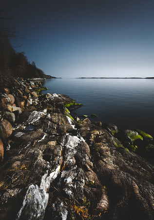 Rugged landscape by the sea in the north of Swedenの写真素材