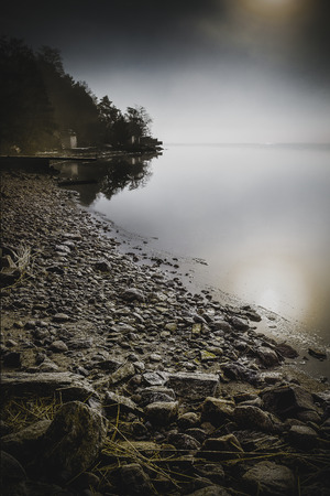Dense mist in the morning down by the seaの写真素材