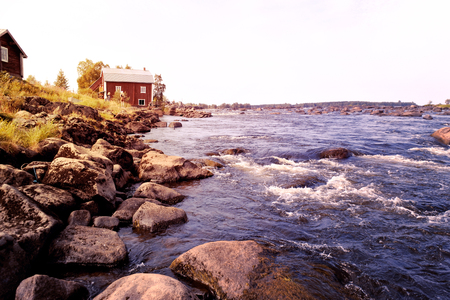 Old water mill by the riverの写真素材