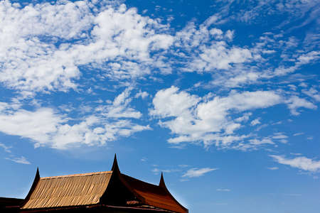 Blue sky background with old style Thai house