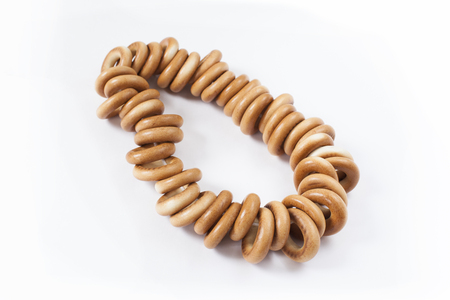 Bagels on rope, isolated on white backgroundの写真素材