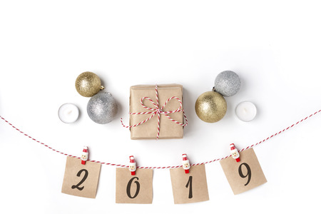 Golden and silver balls, gift, candles, notes with wish on clothespins, Top view White Background Christmas New Yearの写真素材