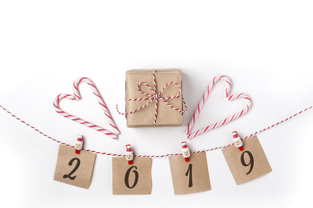 Gift, candles, lollipops, notes with wish on clothespins, Top view White Background Christmas New Yearの写真素材
