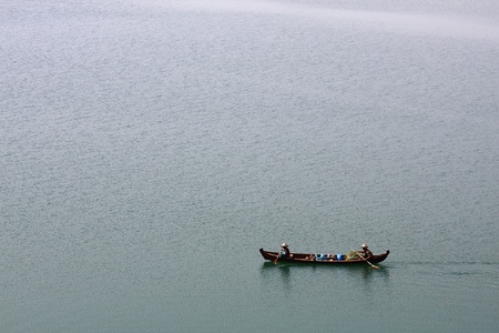 People rowing wherry in lake, non Urban sceneの写真素材