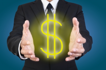 Businessman holding graphic dollar signの写真素材