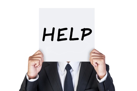 Businessman holding paper that say HELPの写真素材