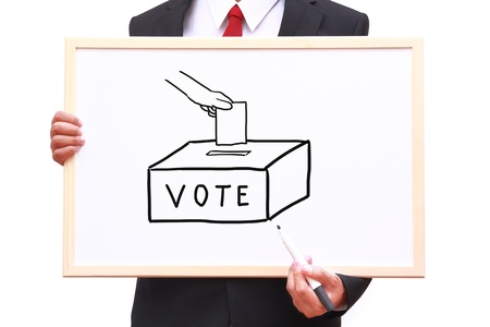 businessman invite people for voting on white boardの写真素材