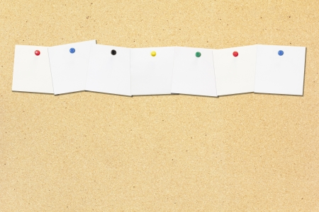 Row of empty note paper note on cork boardの写真素材