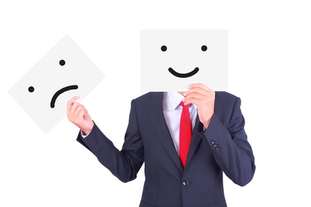 Businessman swap paper to change his emotionの写真素材