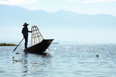 Intha people possess the leg-rowing style and the unique coop-like fishing equipmentの写真素材