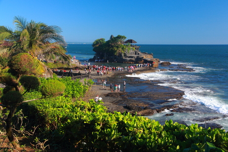 BALI, INDONESIA - MAY 4: Tourists are visit at Tanah Lot temple on May 4, 2013 in Bali Indonesia. The Tanah Lot is one of the most important indu temple.のeditorial素材