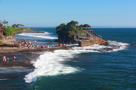 BALI, INDONESIA - MAY 4: Tourists are visit at Tanah Lot temple on May 4, 2013 in Bali Indonesia. The Tanah Lot is one of the most important indu temple.のeditorial素材