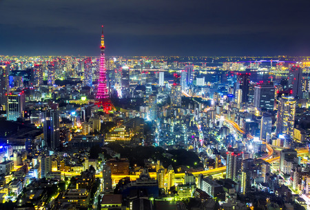 TOKYO, JAPAN - OCTOBER 26: Tokyo cityscape scene night time from sky 
view of the Roppongi Hills Building on Oct 26, 2013. Roppongi is a district of Minato, Tokyo, Japan.