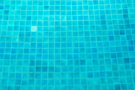 Blue mosaic tiles on the ground of swimming poolの写真素材