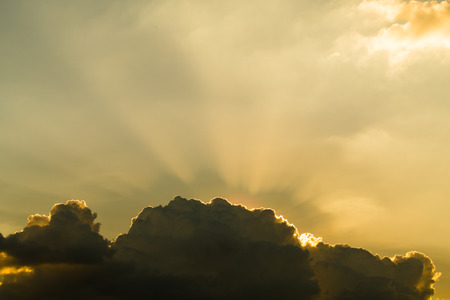 Sun rays through clouds like an dramatic explosion , power nature background.の写真素材
