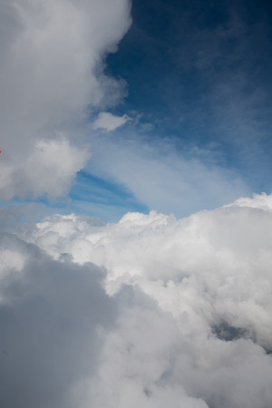 Cloud background scatter over high view on skyの写真素材