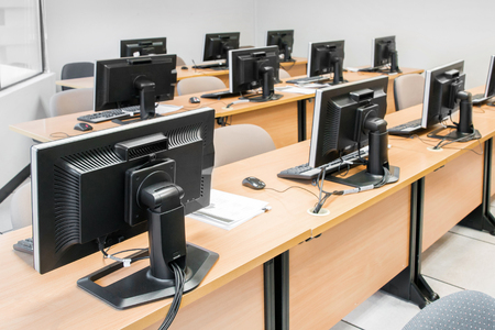 Empty computer room neatly placed for student in a computer lab.の写真素材