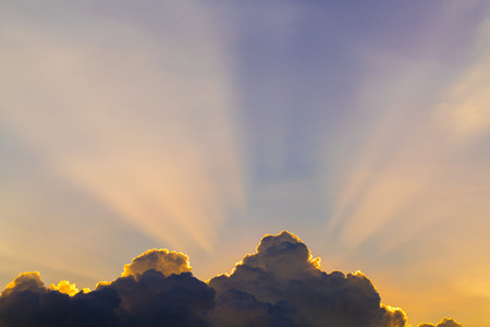 Sun rays through clouds like an dramatic explosion , power nature background.の写真素材