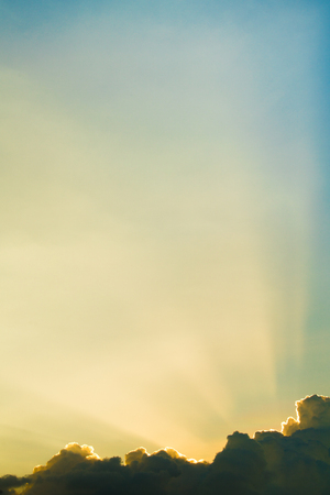 Sun rays through clouds like an dramatic explosion , power nature background.の写真素材
