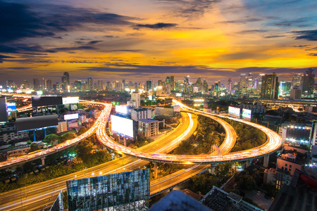 Aerial view of Bangkok building and Express ways , Thailand. Modern building increasing number...