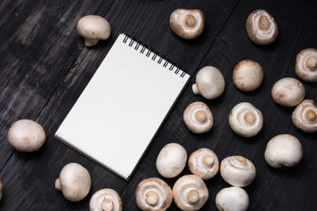 Fresh champignons in sack and note for record