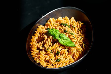 Italian Pasta: Chickpeas fusilli with garlic pesto, olive oil and basilの写真素材