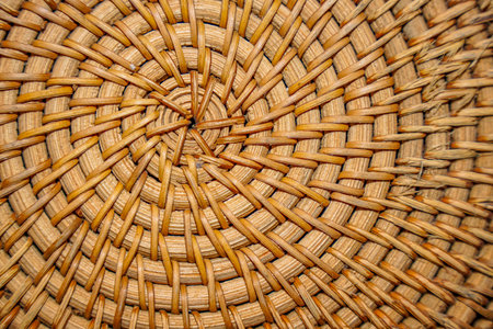 Close-up of a woven basket showcasing intricate craftsmanship and natural textures, perfect for backgrounds and design elements.の写真素材