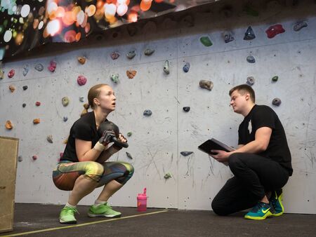 NOVOSIBIRSK, RUSSIA - DECEMBER 18 2017: The instructor takes the performance of the crossfit complex...