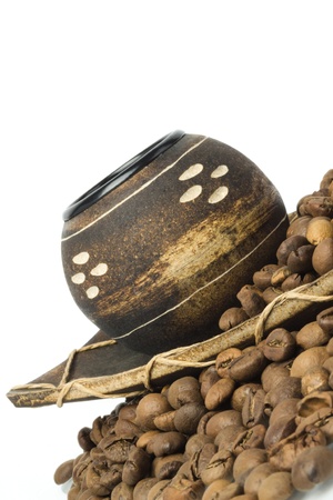 coffee beans, wooden cup and plate on white backgroundの写真素材