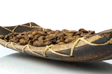 coffee beans, wooden plate on white backgroundの写真素材