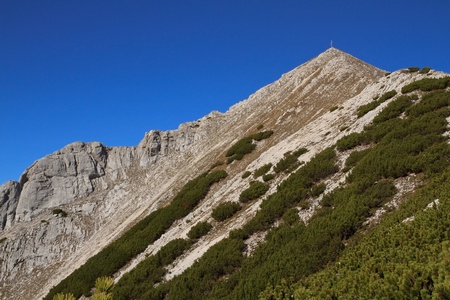View up to the Brunnstein Peak Austria, against blue skyの写真素材