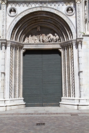Facade of the medieval Como cathedral on Lake Como in Italy, Lombardyの写真素材