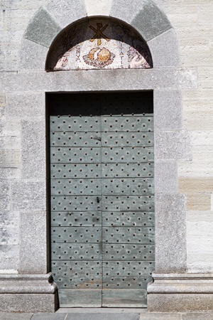 Historic church door in Italyの写真素材