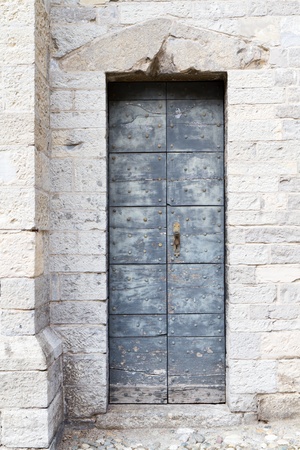 Historic church door in Italyの写真素材