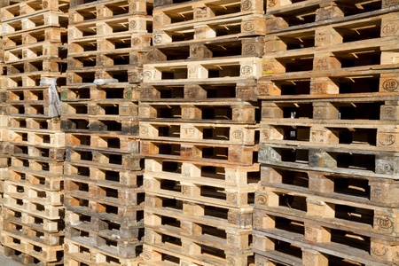Pallets stacked in a pile outside