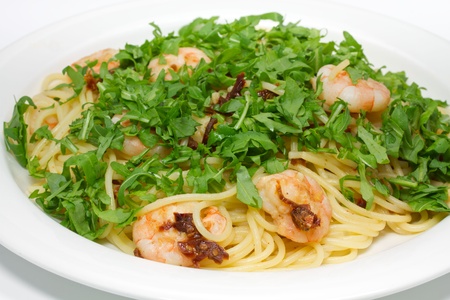 Spaghetti with shrimp and rucolaの写真素材