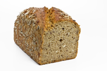 Loaf of fresh bread with sunflower seeds on white backgroundの写真素材
