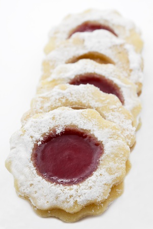 Delicious christmas cookies with raspberry jam on whiteの写真素材