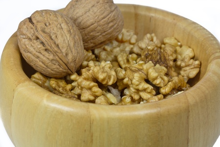 Some Walnuts in a wooden bowl