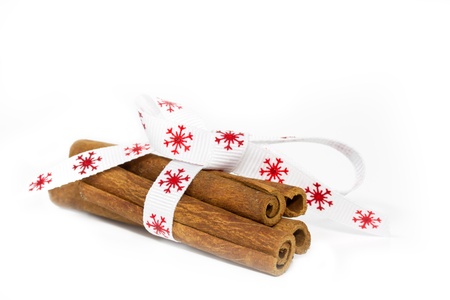 Four cinnamon sticks on white backgroundの写真素材