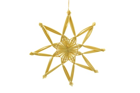 Straw star for a christmas tree on white backgroundの写真素材
