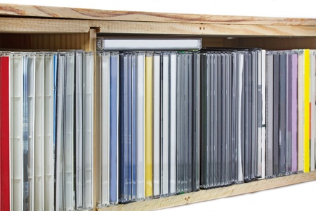 Collection of Compact Discs (CDs) in a shelf