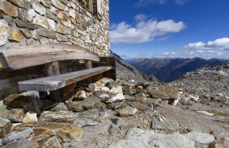 Wooden resting bench in the italian alpsの写真素材