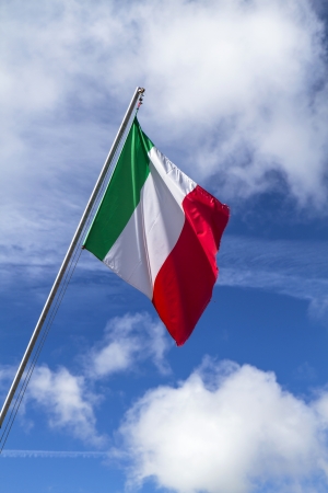 National flag of Italy against blue skyの写真素材