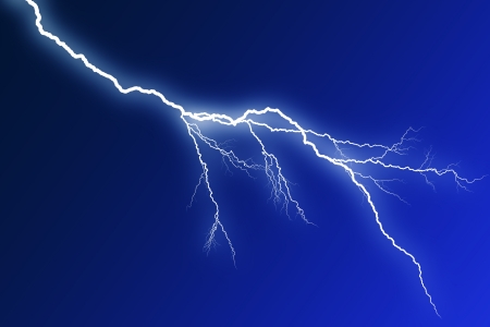 Flash lightning on blue backgroundの写真素材
